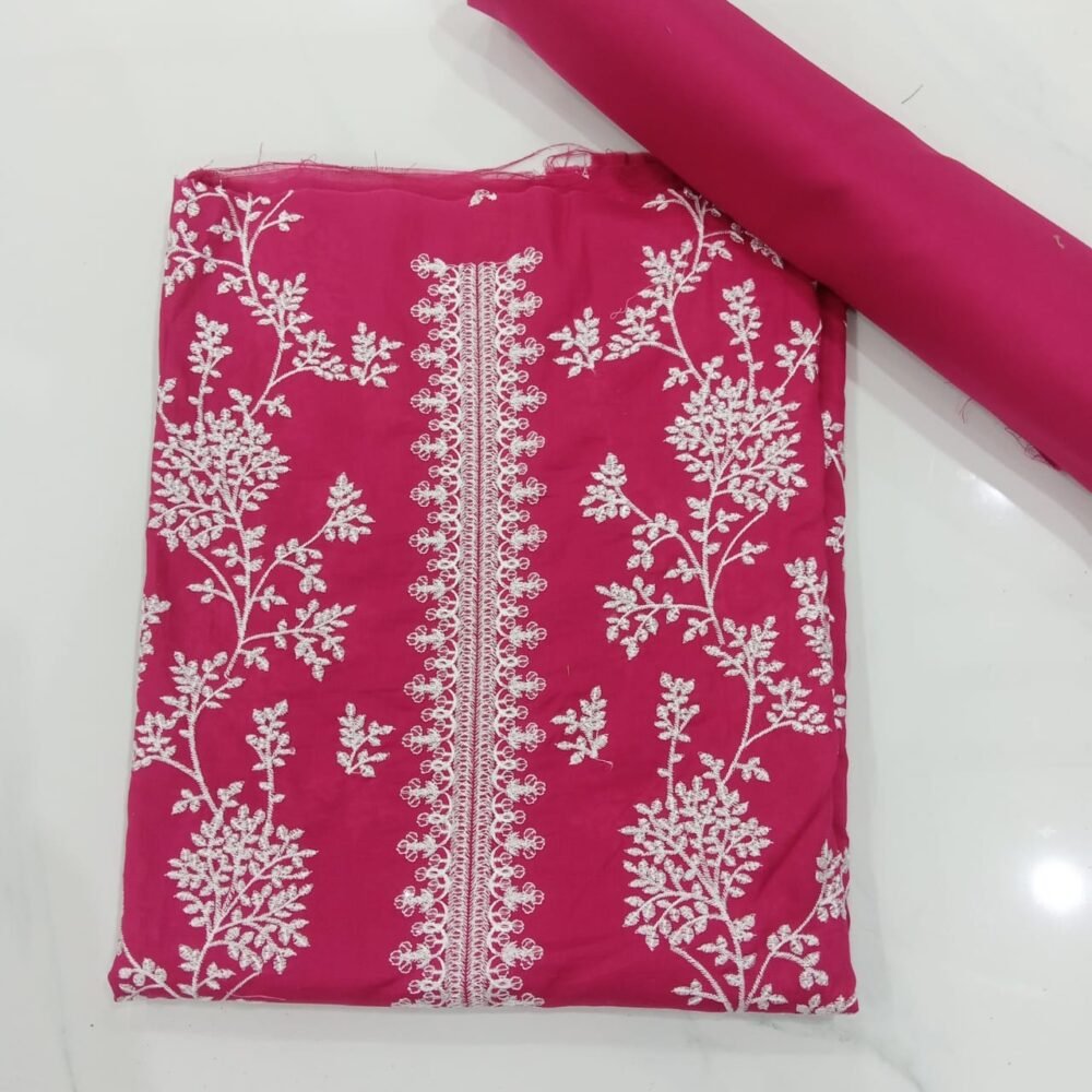 a pink fabric with white embroidery